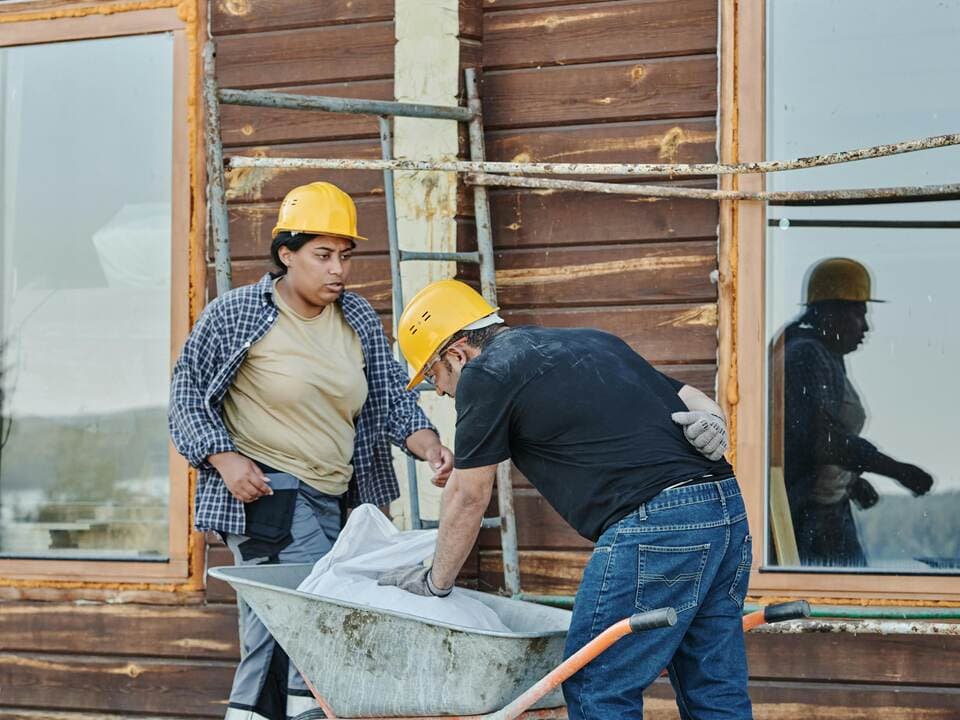 Builder at work on construction site