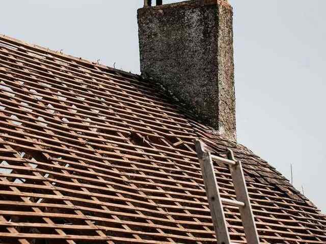 Roofer working on roof